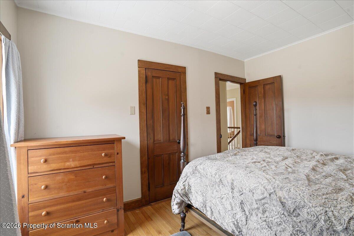 795 Wescott Road New Milford, PA 18834 - Photo 55 of 81 a bedroom with a bed and a dresser