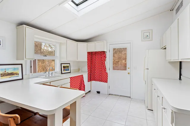 a room with furniture and air hockey table