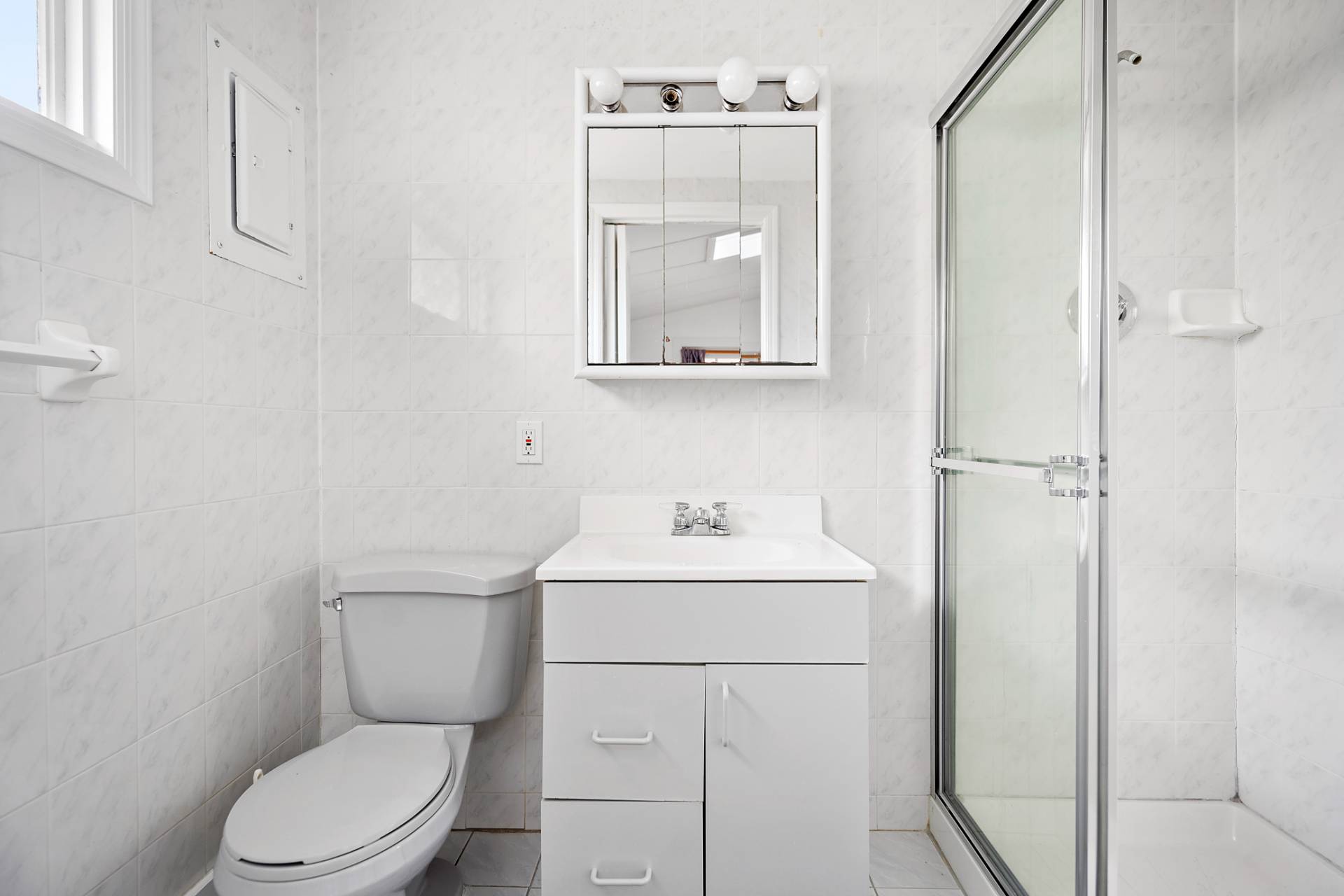 5 South Dorset Drive Montauk, NY 11954 - Photo 17 of 20 a bathroom with a toilet a sink and mirror