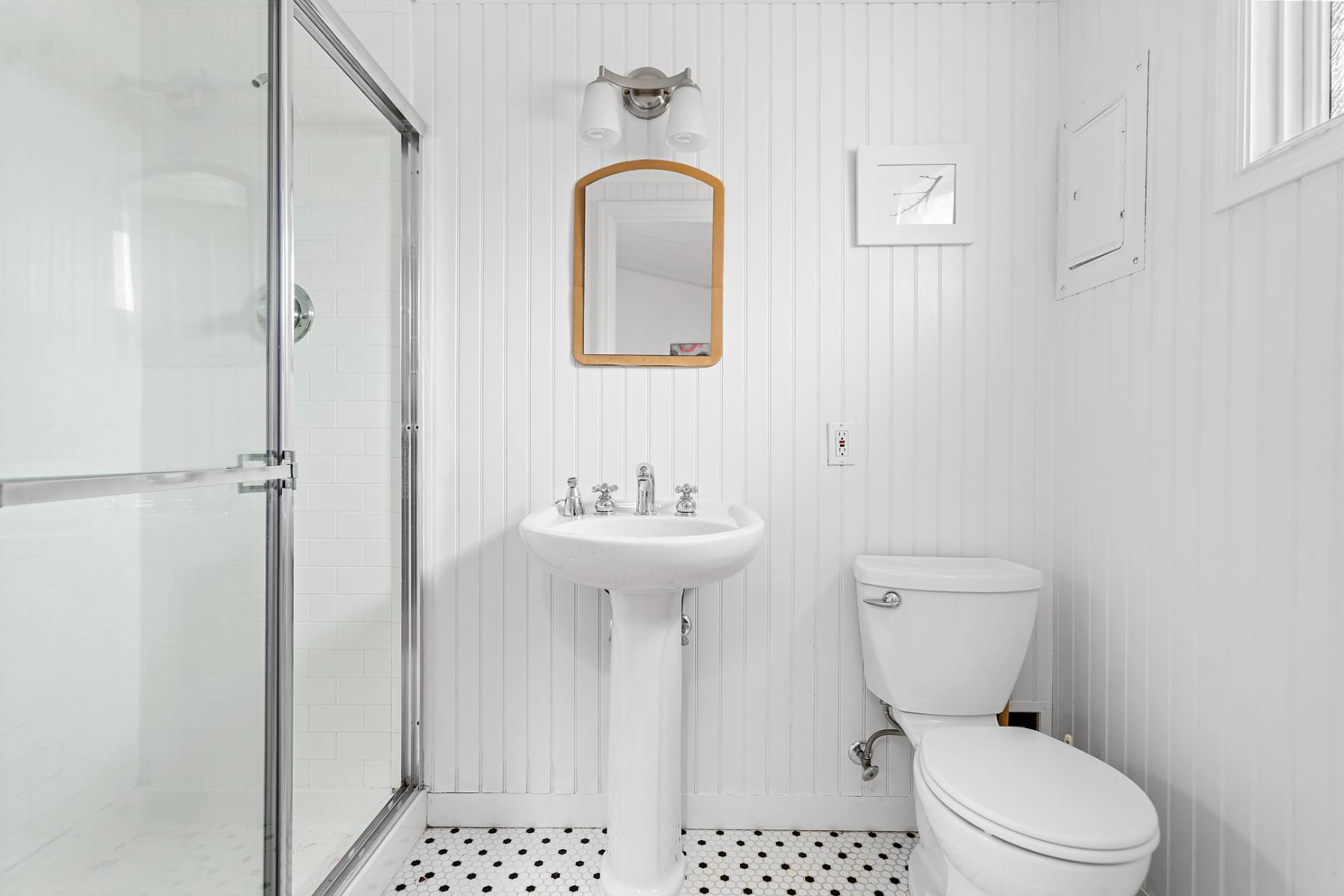 5 South Dorset Drive Montauk, NY 11954 - Photo 19 of 20 a bathroom with a toilet sink and mirror
