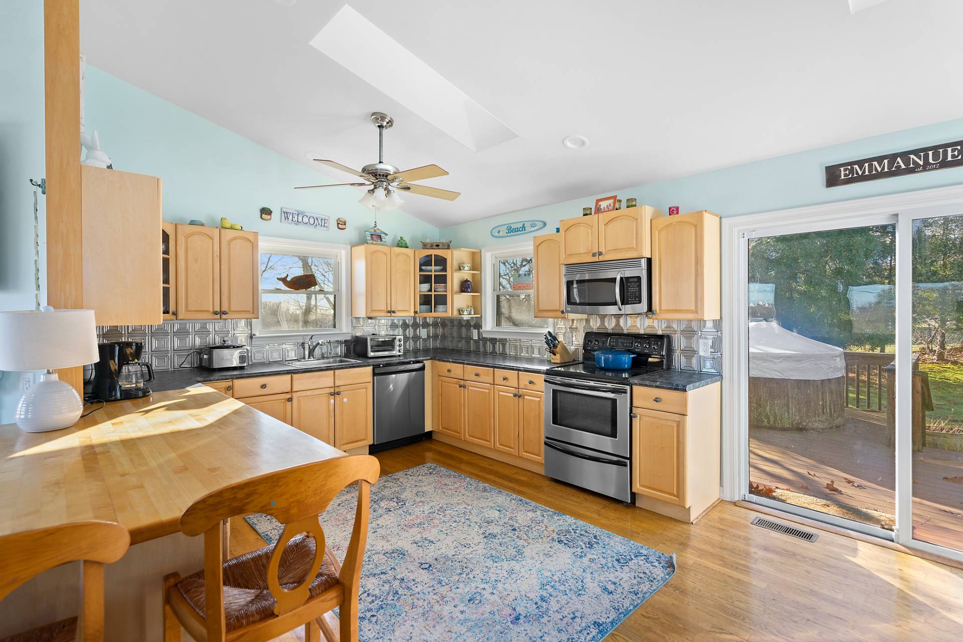 5 South Dorset Drive Montauk, NY 11954 - Photo 2 of 20 a kitchen with stainless steel appliances granite countertop a sink stove and refrigerator