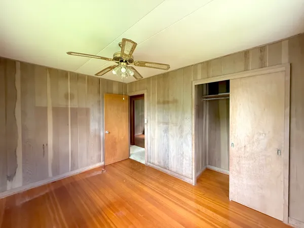 a view of a livingroom with a chandelier fan