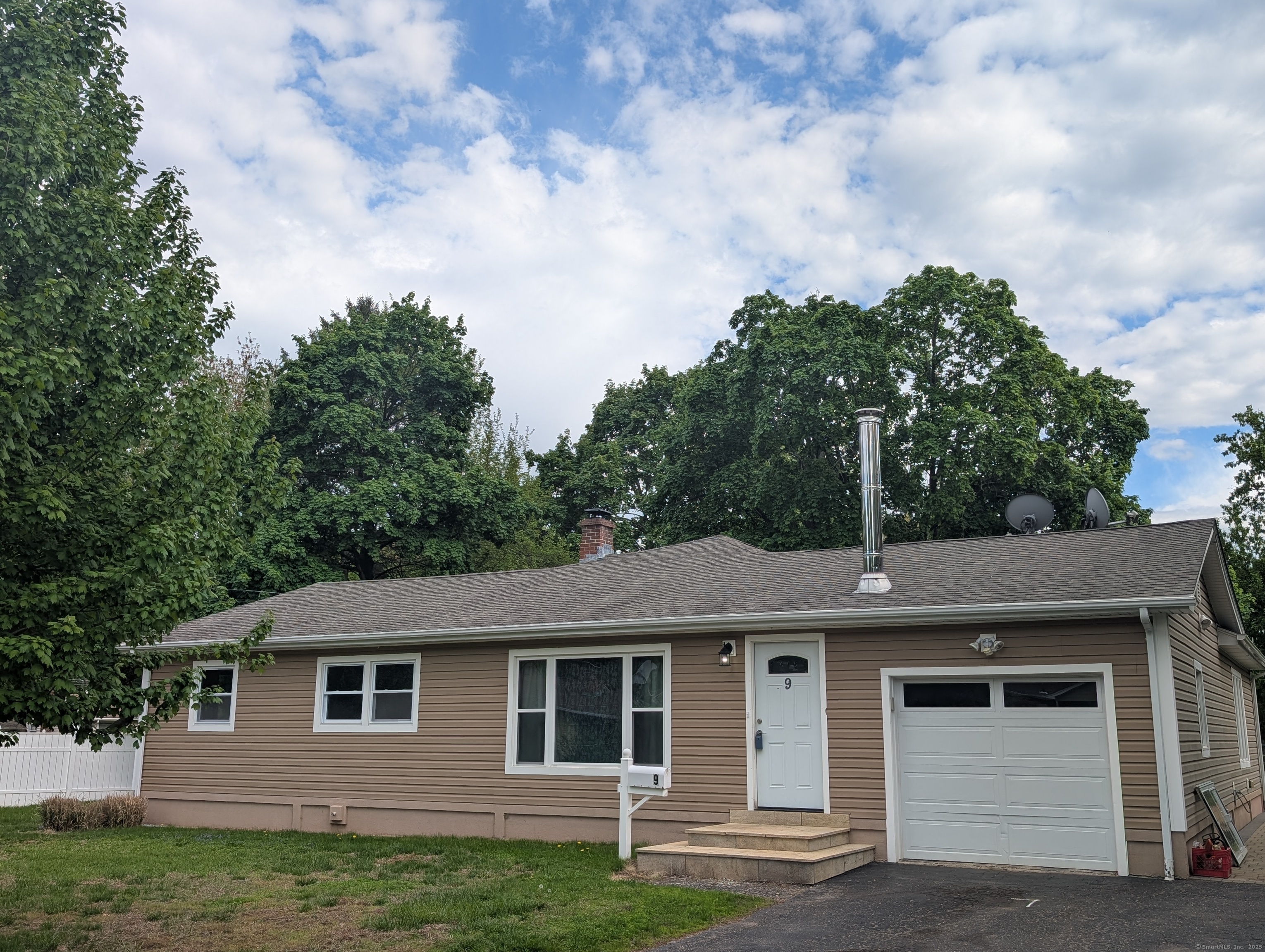 9 Washington Road Windsor, CT 06095 - Photo 1 of 1 a front view of a house with garden