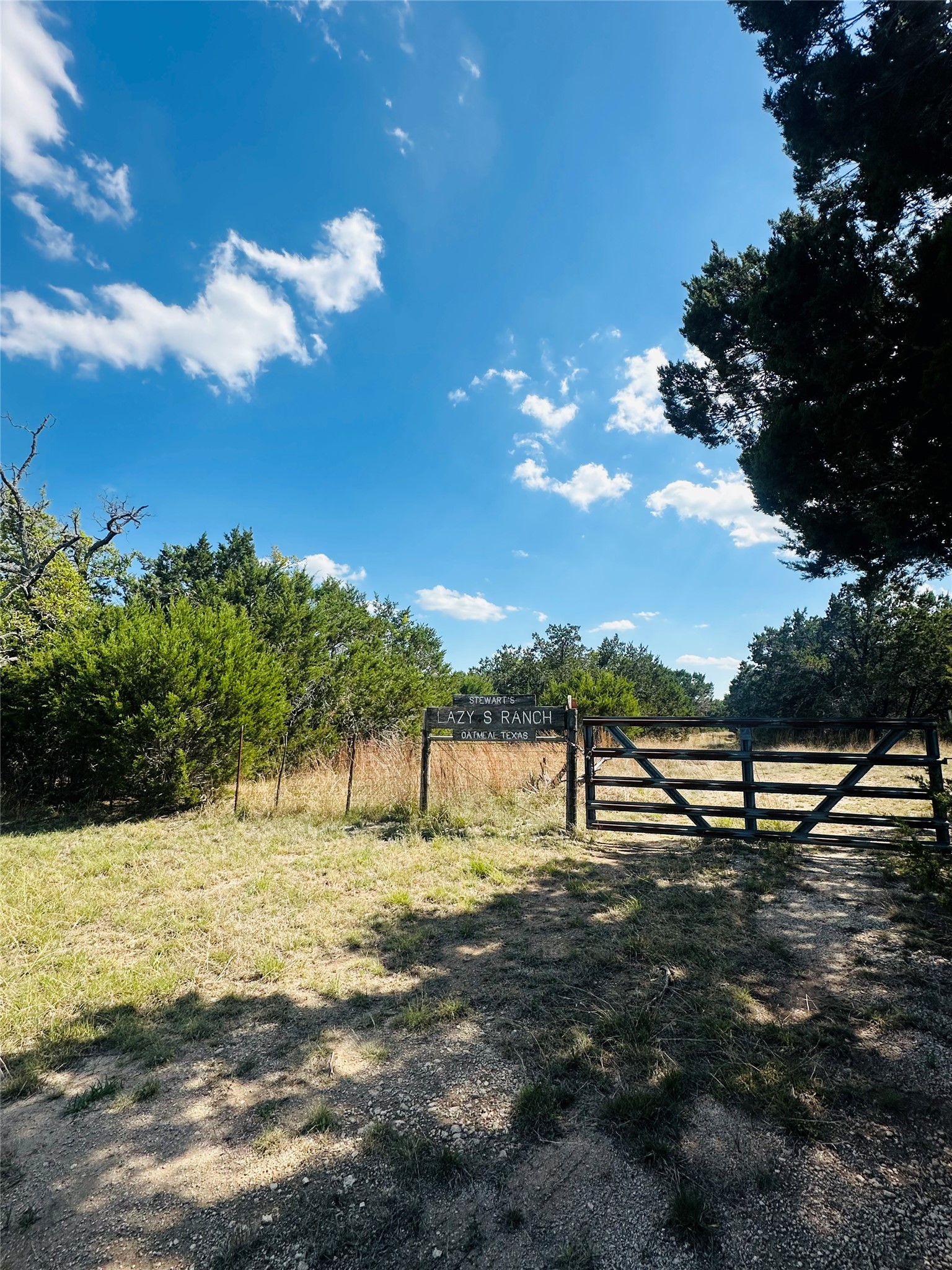 336 County Road 334 Roads Burnet, TX 78611 - Photo 2 of 11 Secure gated entry welcomes you to the serene expanse of this property.