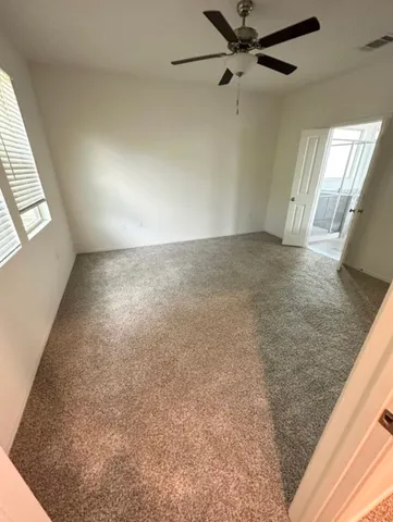 a view of an empty room and closet area