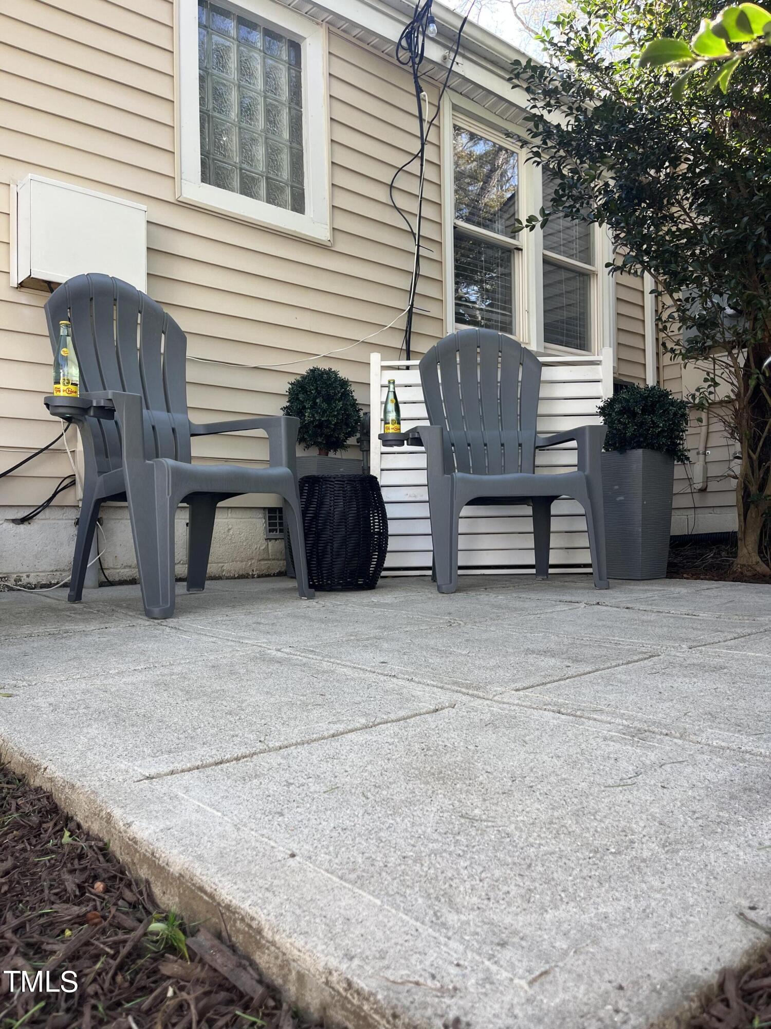 2357 Bernard Street Raleigh, NC 27608 - Photo 12 of 14 a view of a patio with a table and chairs and a barbeque
