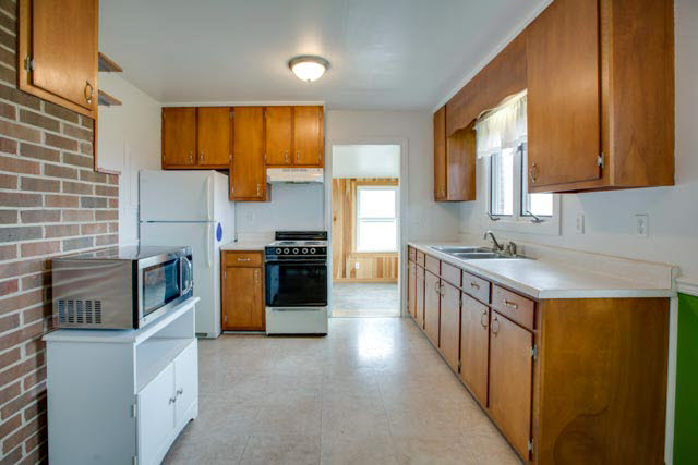 984 Ridge Road Bridgewater, VA 22812 - Photo 2 of 29 a kitchen with a sink stove and refrigerator