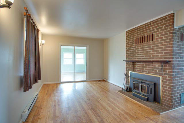 984 Ridge Road Bridgewater, VA 22812 - Photo 4 of 29 a view of an empty room with wooden floor and a window