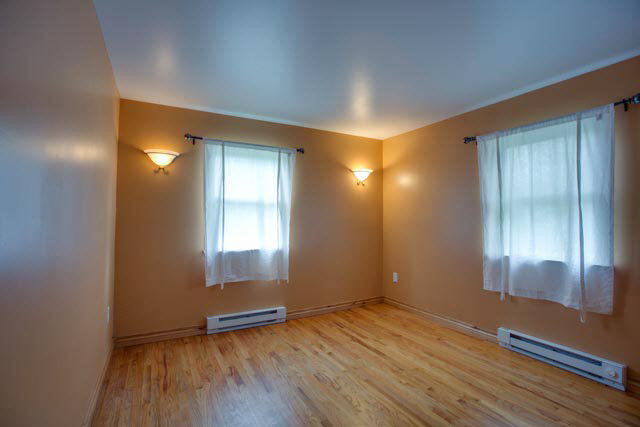 984 Ridge Road Bridgewater, VA 22812 - Photo 7 of 29 an empty room with wooden floor and windows