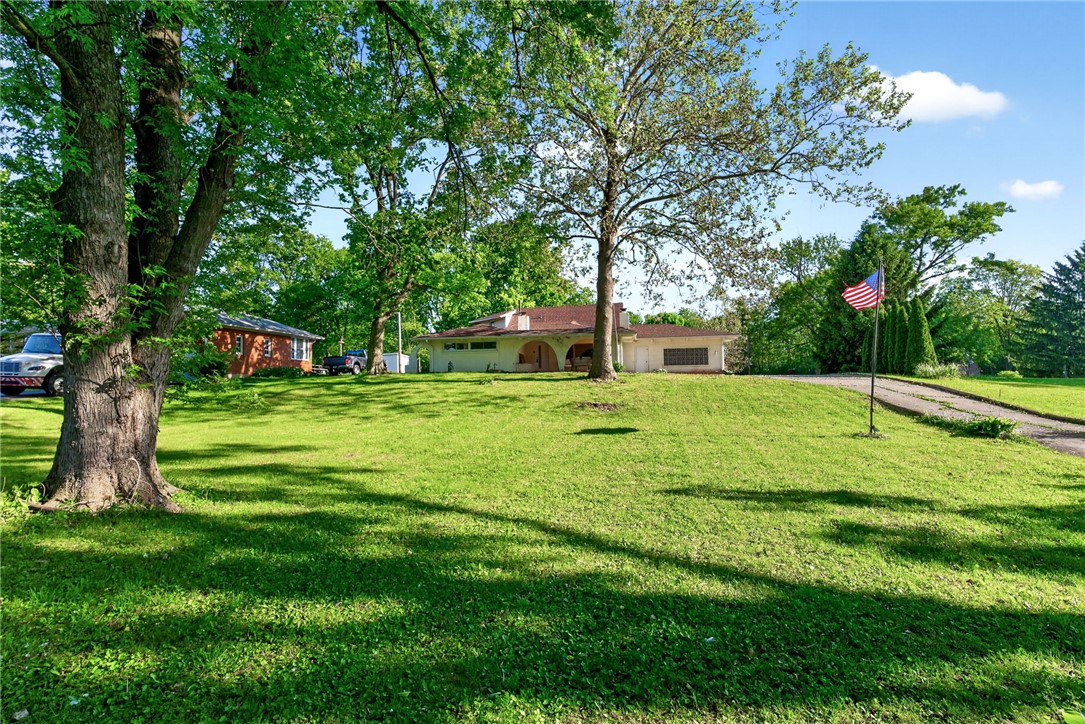2684 Arthur Road Springfield, OH 45502 - Photo 43 of 69 Expansive green grounds surround this charming residence, offering serene outdoor living.