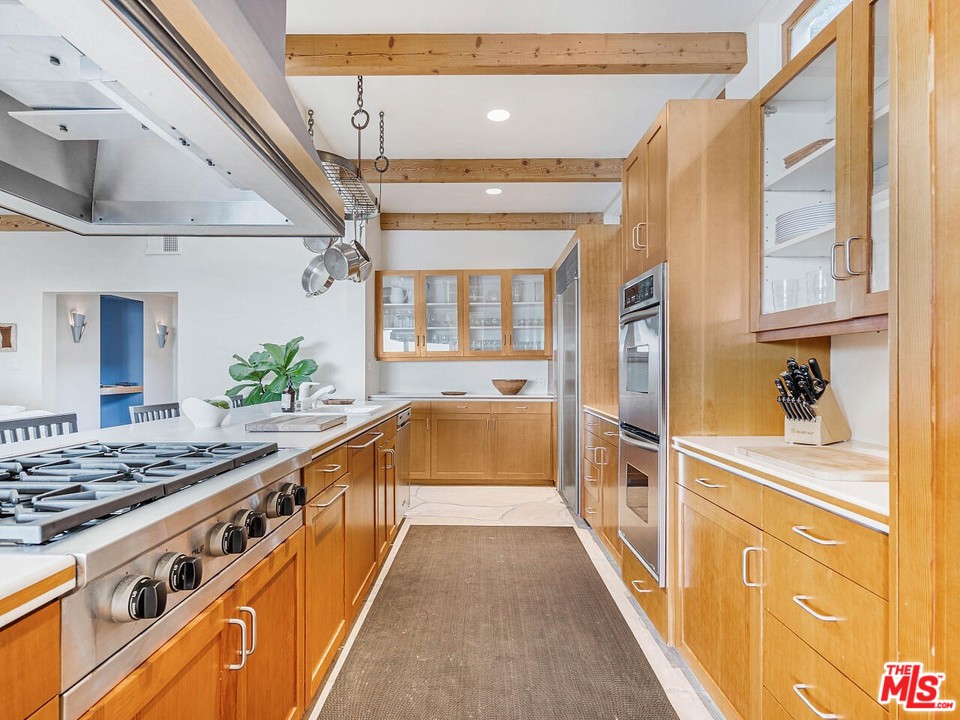 31376 Broad Beach Road Malibu, CA 90265 - Photo 11 of 26 a kitchen with stainless steel appliances a stove and a refrigerator