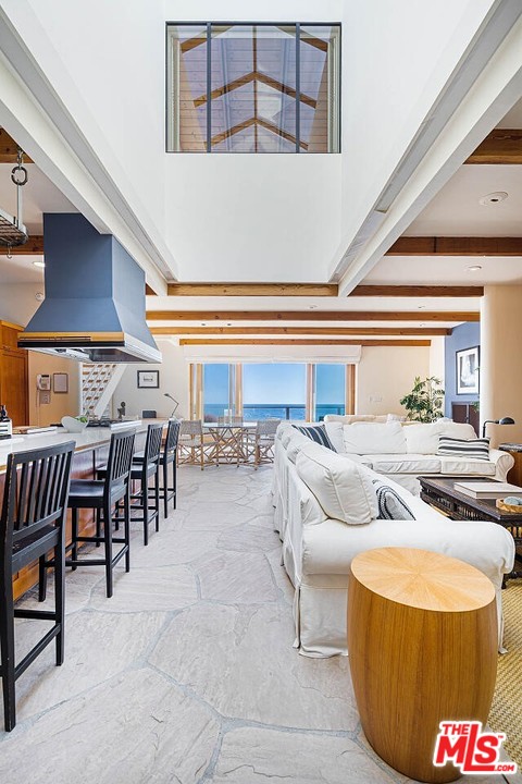 31376 Broad Beach Road Malibu, CA 90265 - Photo 8 of 26 a living room with furniture and a chandelier