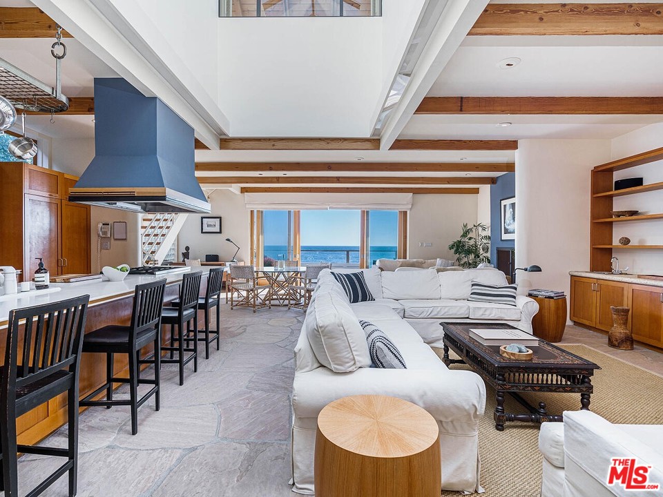 31376 Broad Beach Road Malibu, CA 90265 - Photo 9 of 26 a living room with furniture kitchen view and a large window