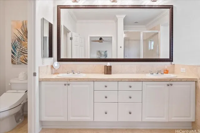 a bathroom with double sink and a mirror