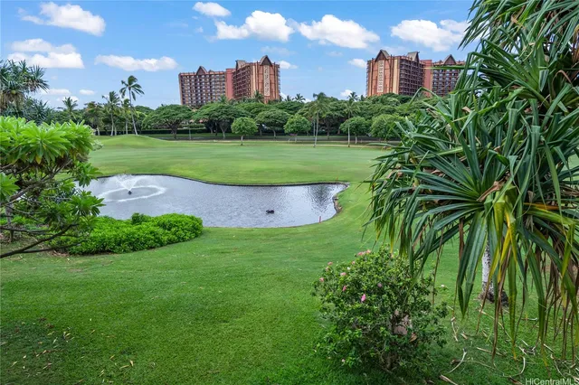 a view of a stadium that has a big yard with plants