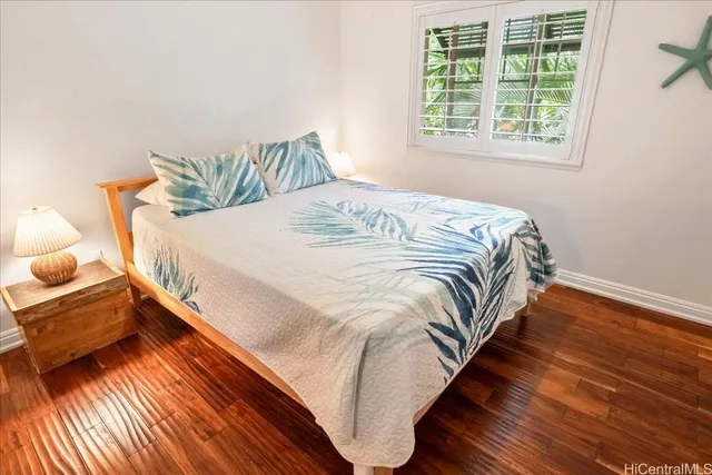 a bedroom with bed and window