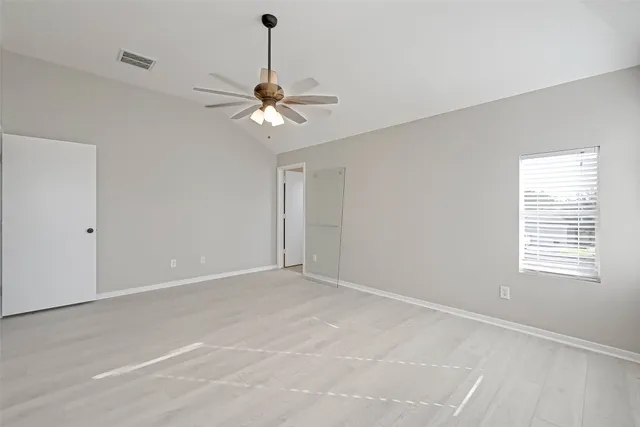 a bathroom with a granite countertop double vanity sink and a mirror
