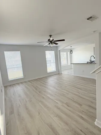 a view of an empty room with a window