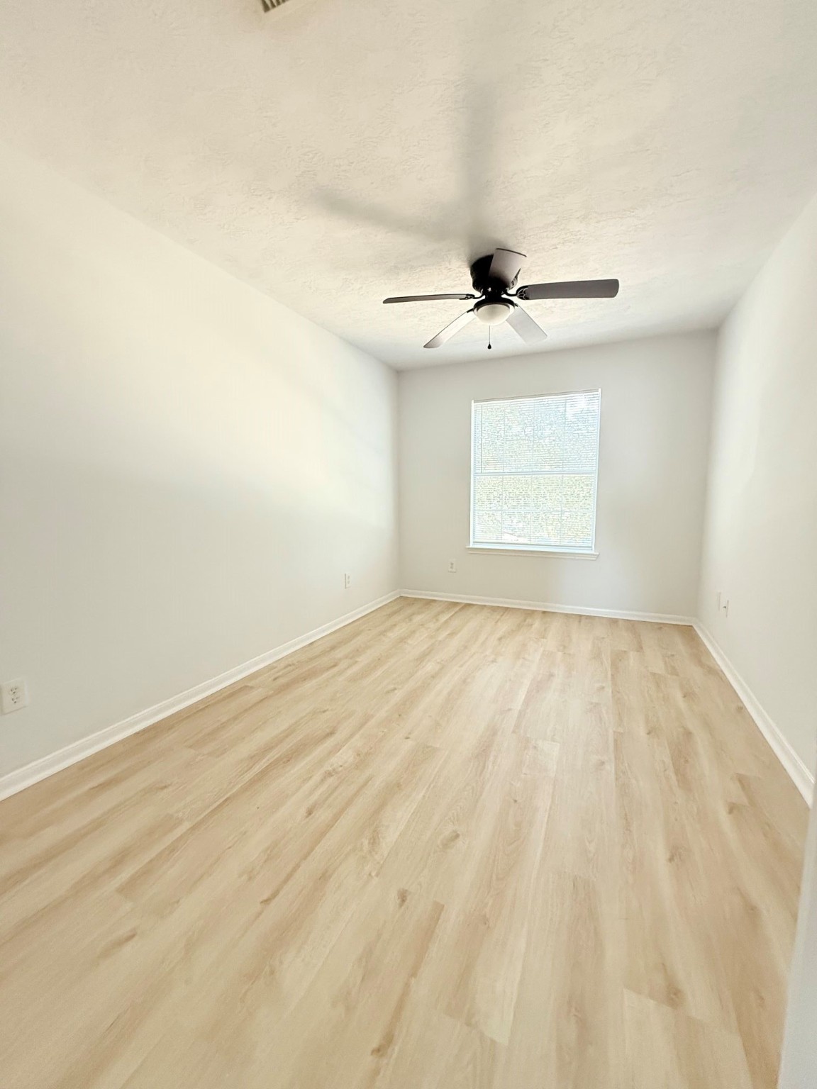 6810 Strathmore Pl Court Katy, TX 77449 - Photo 6 of 14 wooden floor in an empty room