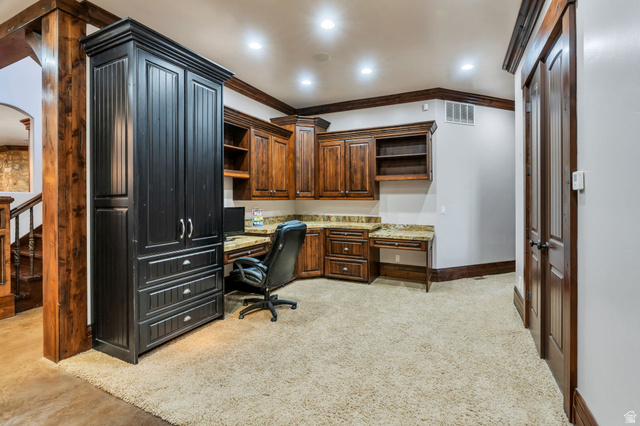 811 South High Ridge Drive Alpine, UT 84004 - Photo 54 of 98 Office with ornamental molding, built in study area, recessed lighting, arched walkways, and light colored carpet