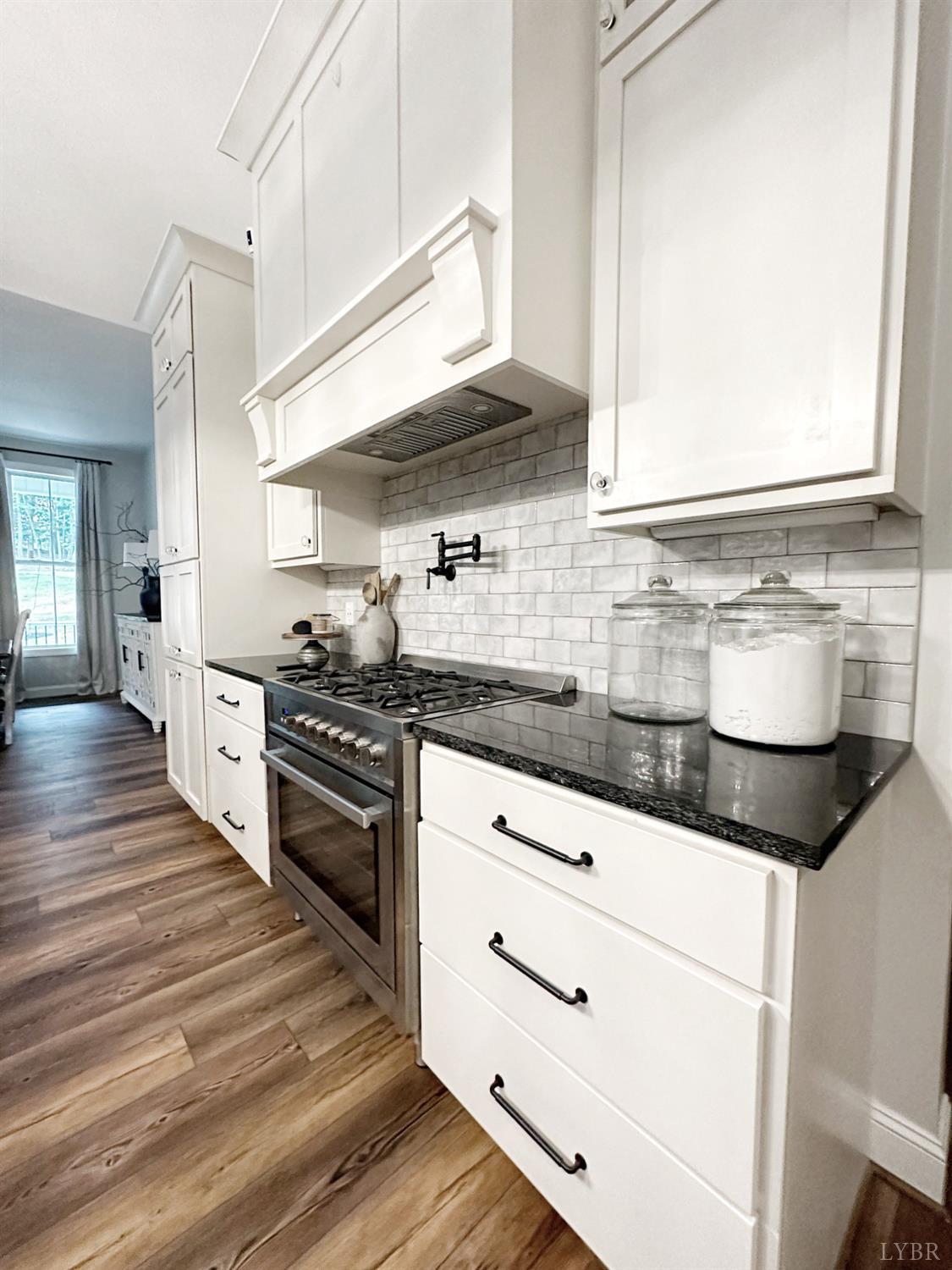4969 Otterville Road Goode, VA 24556 - Photo 11 of 69 a kitchen with granite countertop a sink stainless steel appliances and cabinets