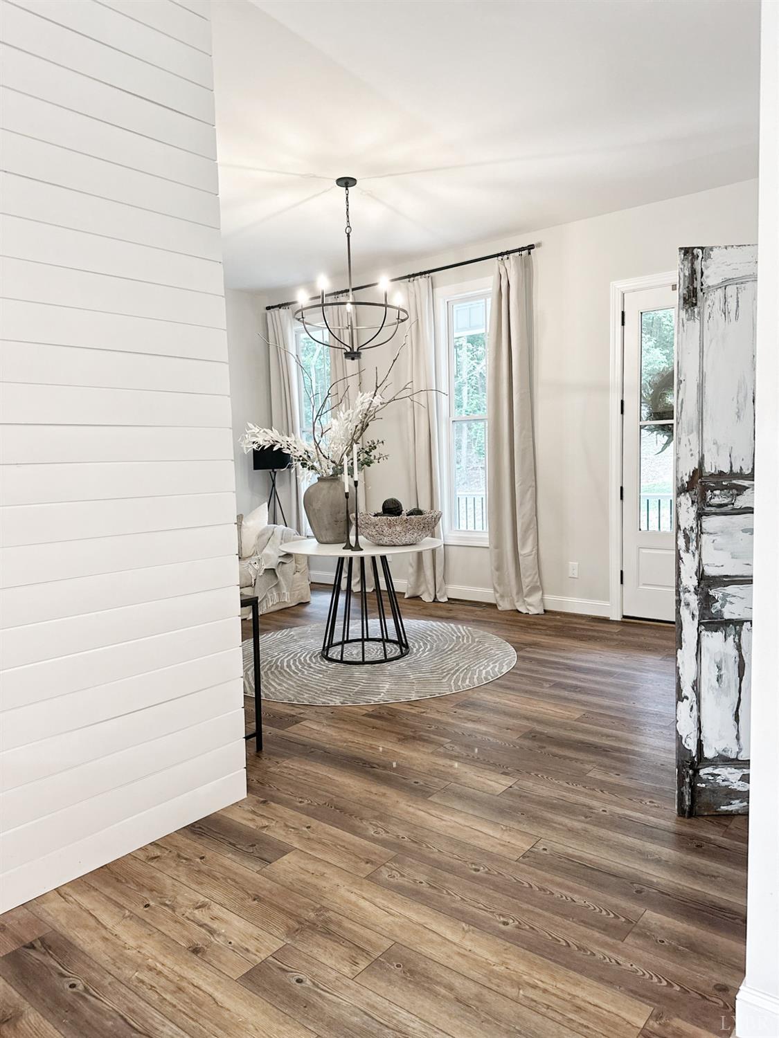 4969 Otterville Road Goode, VA 24556 - Photo 28 of 69 a view of empty room with wooden floor windows and outdoor view