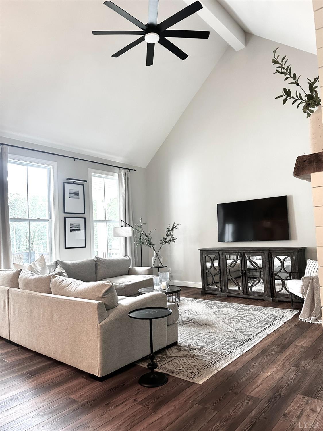 4969 Otterville Road Goode, VA 24556 - Photo 31 of 69 a living room with furniture and a flat screen tv with wooden floor