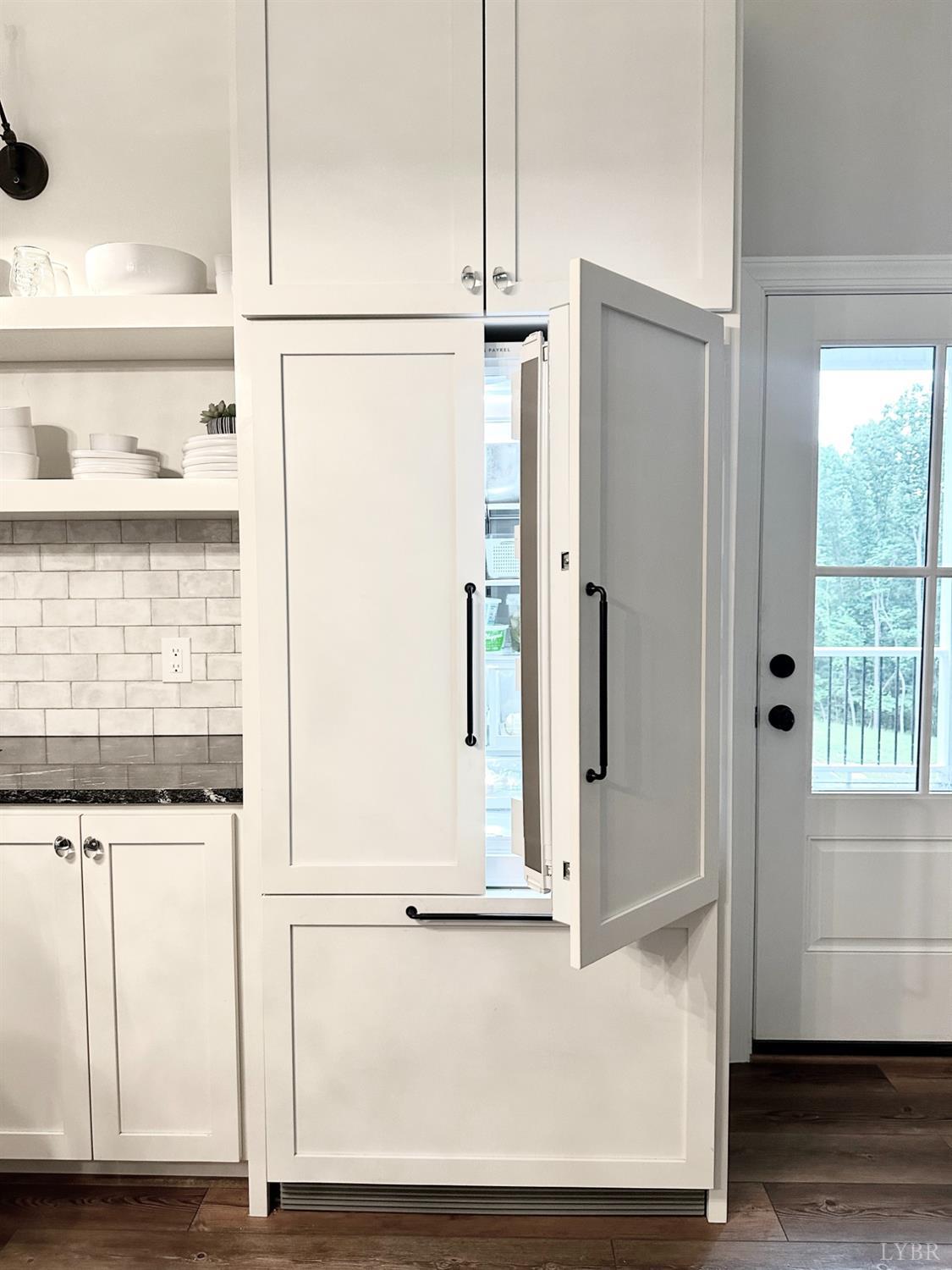 4969 Otterville Road Goode, VA 24556 - Photo 34 of 69 a view of kitchen with granite countertop cabinets and black white appliances