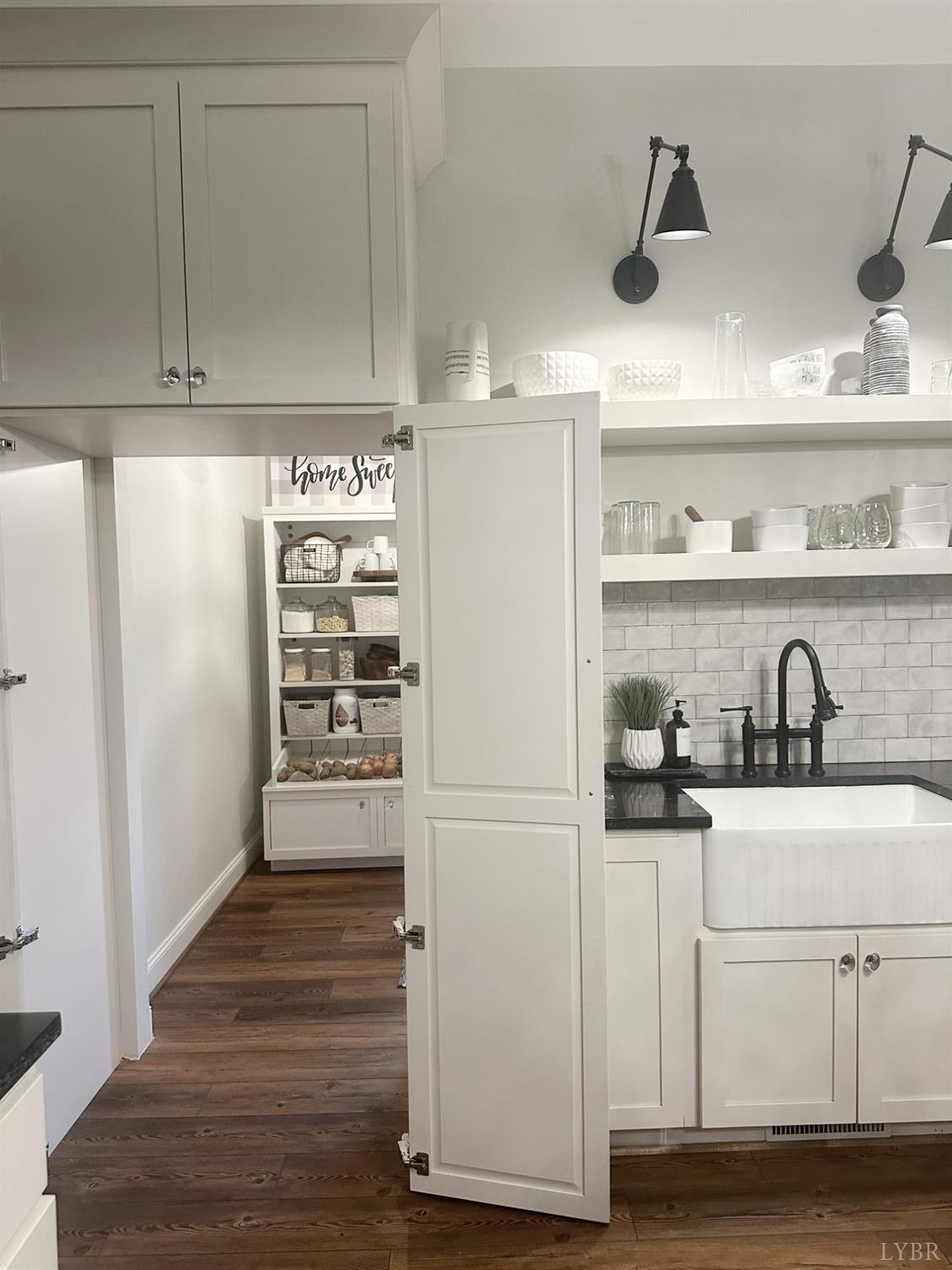 4969 Otterville Road Goode, VA 24556 - Photo 4 of 69 a kitchen with granite countertop a refrigerator and cabinets