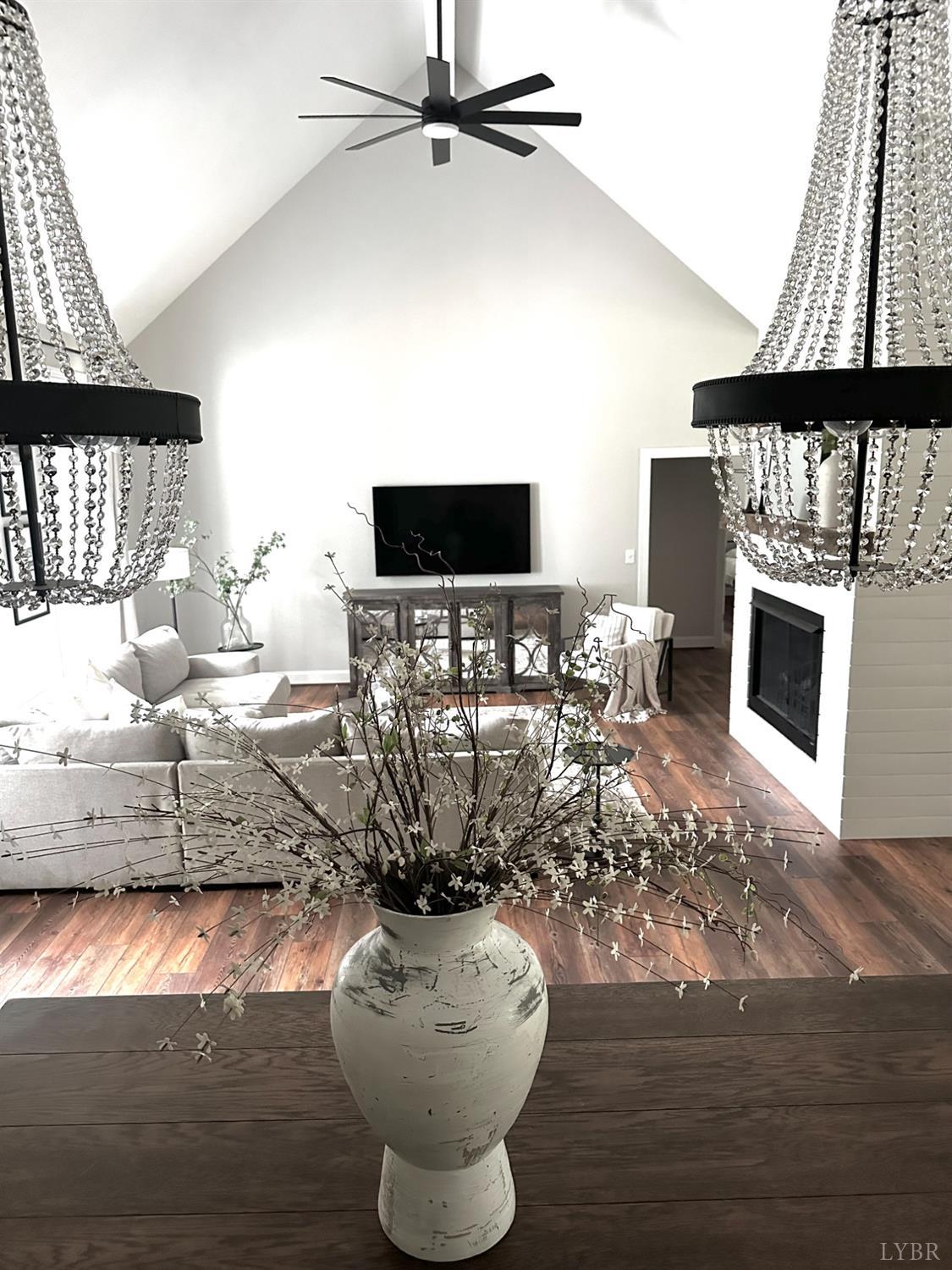 4969 Otterville Road Goode, VA 24556 - Photo 50 of 69 a living room with furniture a fireplace and a flat screen tv