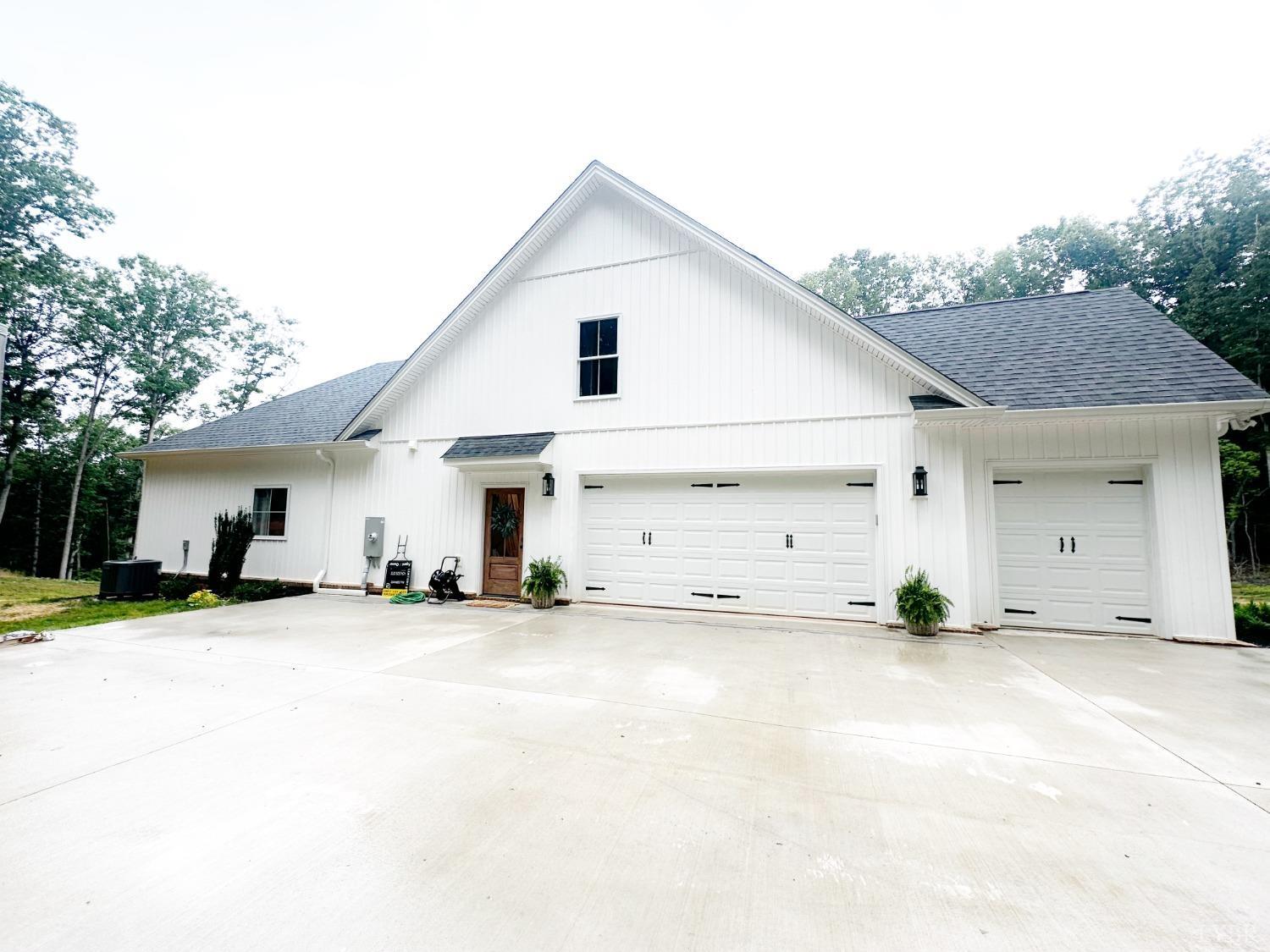 4969 Otterville Road Goode, VA 24556 - Photo 55 of 69 a view of a house with a yard and garage