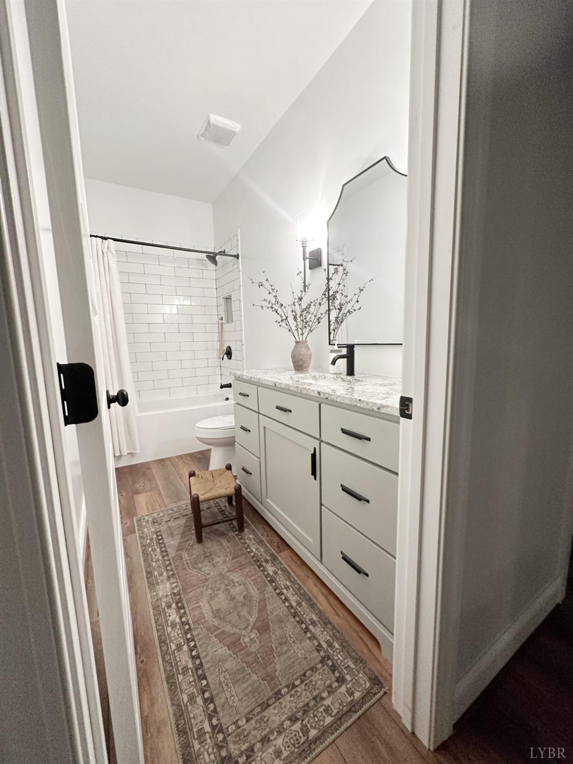4969 Otterville Road Goode, VA 24556 - Photo 6 of 69 a bathroom with a sink a toilet and shower