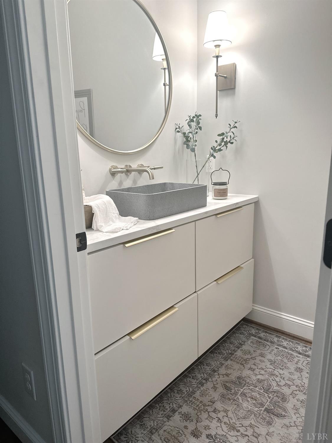 4969 Otterville Road Goode, VA 24556 - Photo 67 of 69 a bathroom with a sink and a mirror