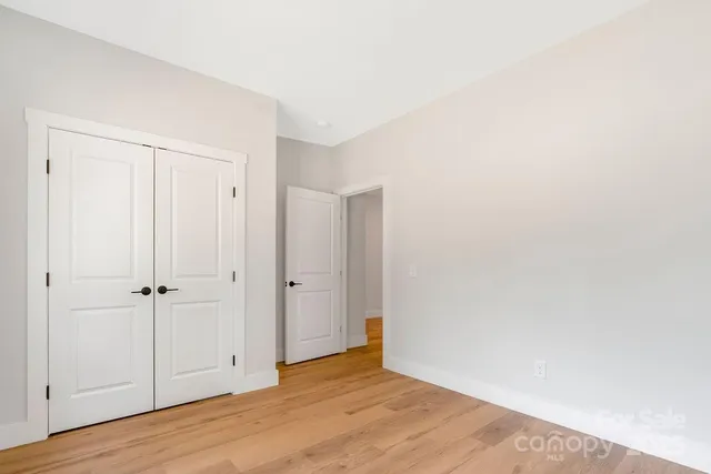 a bathroom with a tub sink toilet and a mirror