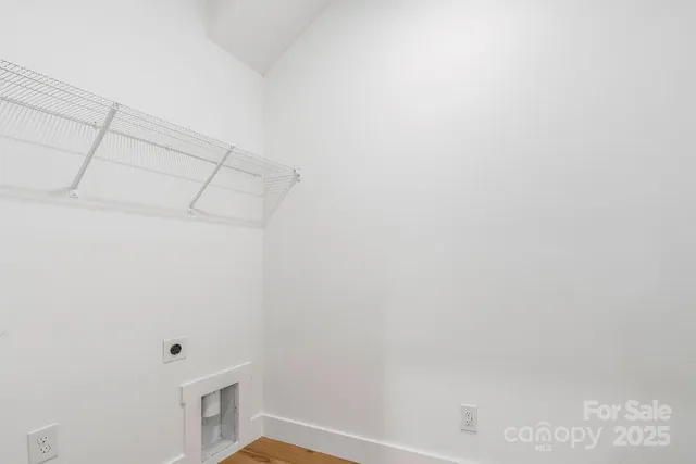 a kitchen with stainless steel appliances a sink stove and cabinets