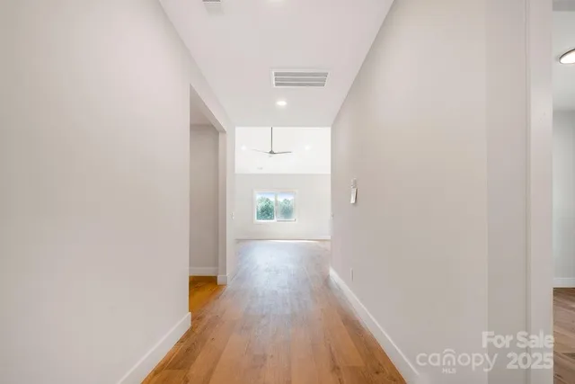 a view of gallery with wooden floor
