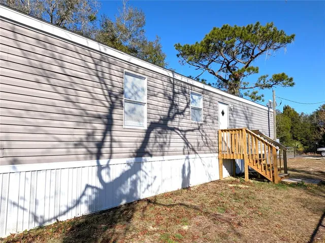 a view of a balcony with a tree