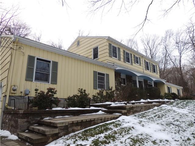 5 Pond Brook Road Newtown, CT 06470 - Photo 1 of 1 a front view of a house with yard
