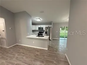 a view of kitchen with wooden floor