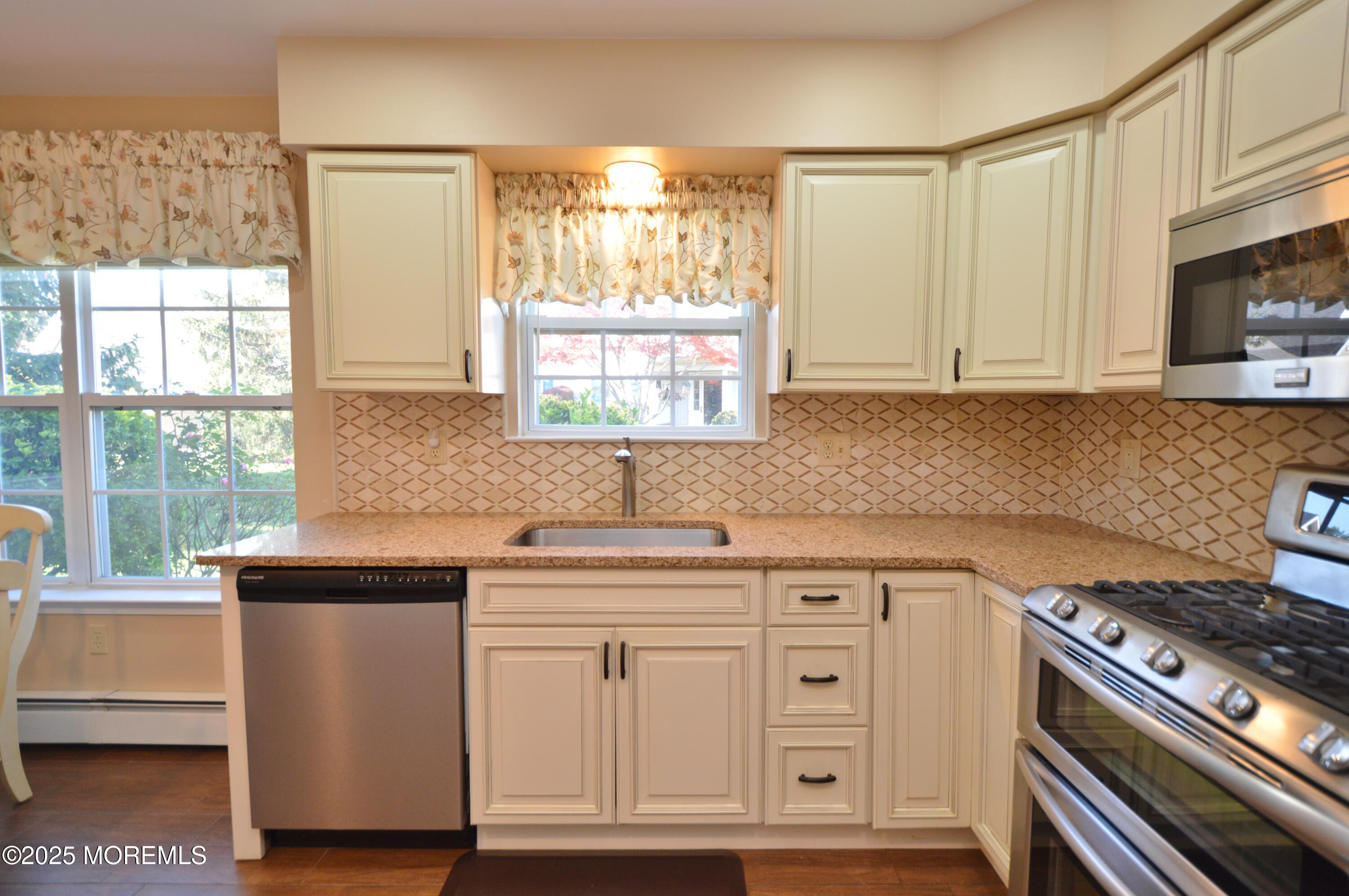 2382 Braddock Road Toms River, NJ 08755 - Photo 18 of 56 a kitchen with cabinets appliances a sink and a window