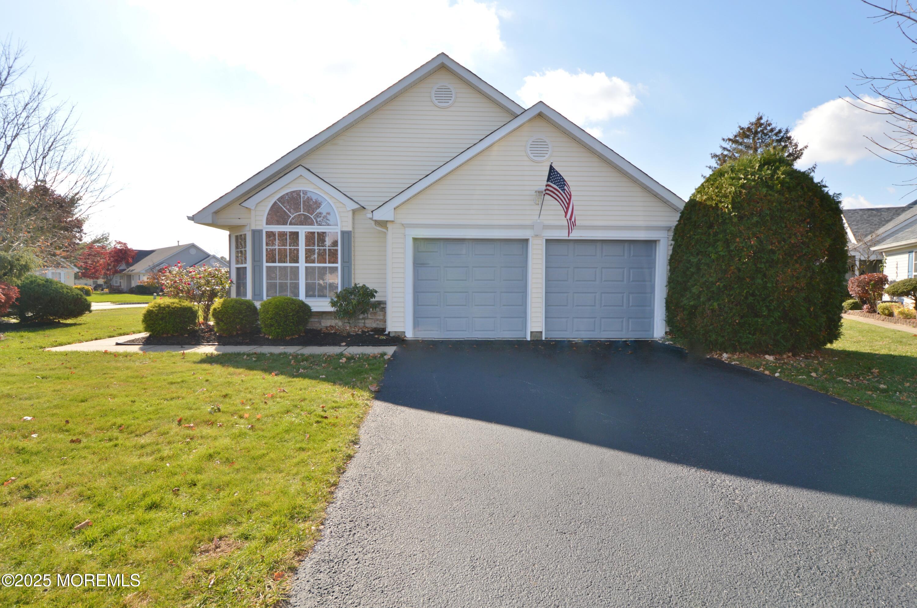 2382 Braddock Road Toms River, NJ 08755 - Photo 2 of 56 a view of a white house next to a yard with big trees