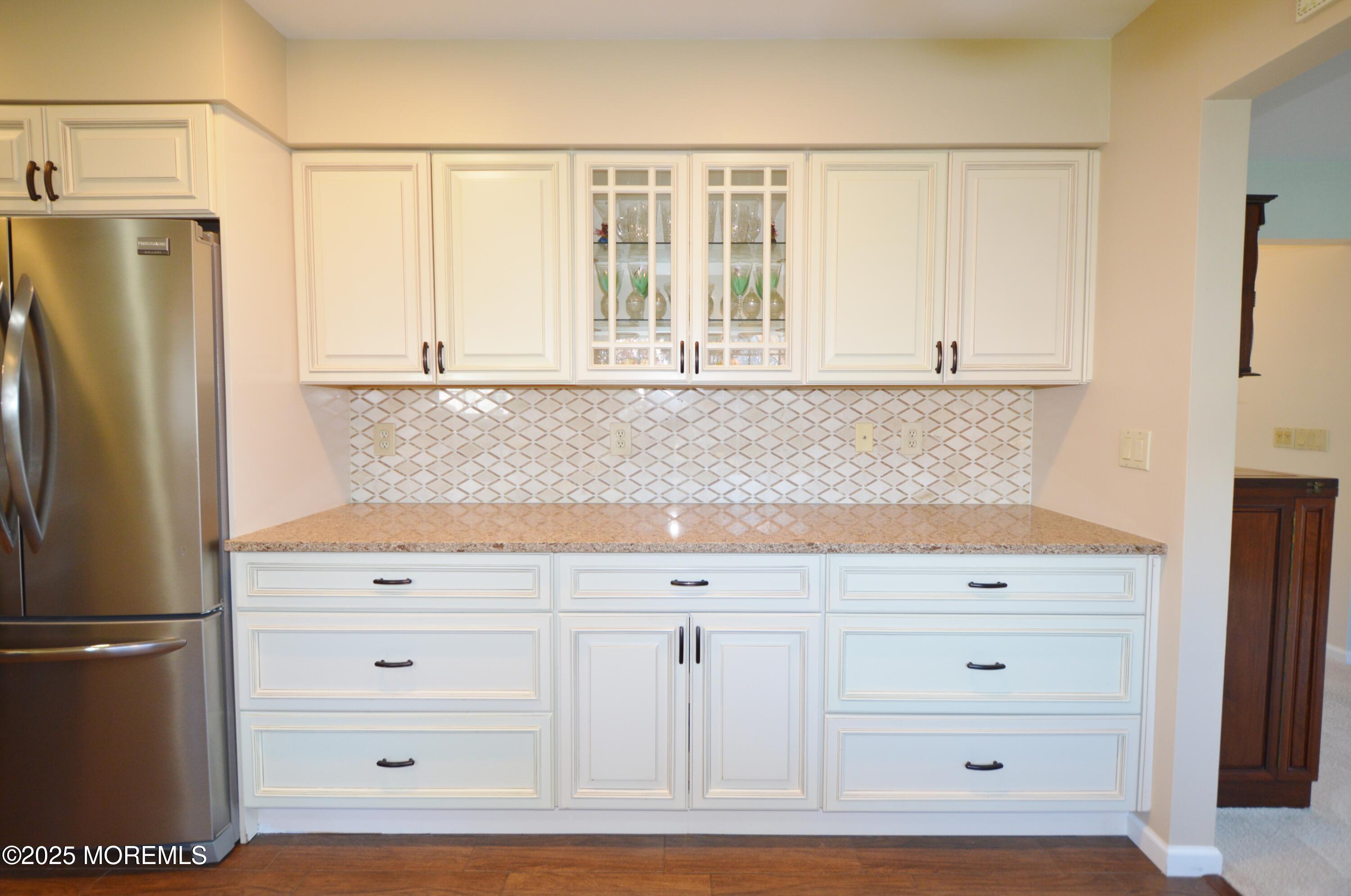 2382 Braddock Road Toms River, NJ 08755 - Photo 21 of 56 a kitchen with white cabinets and refrigerator