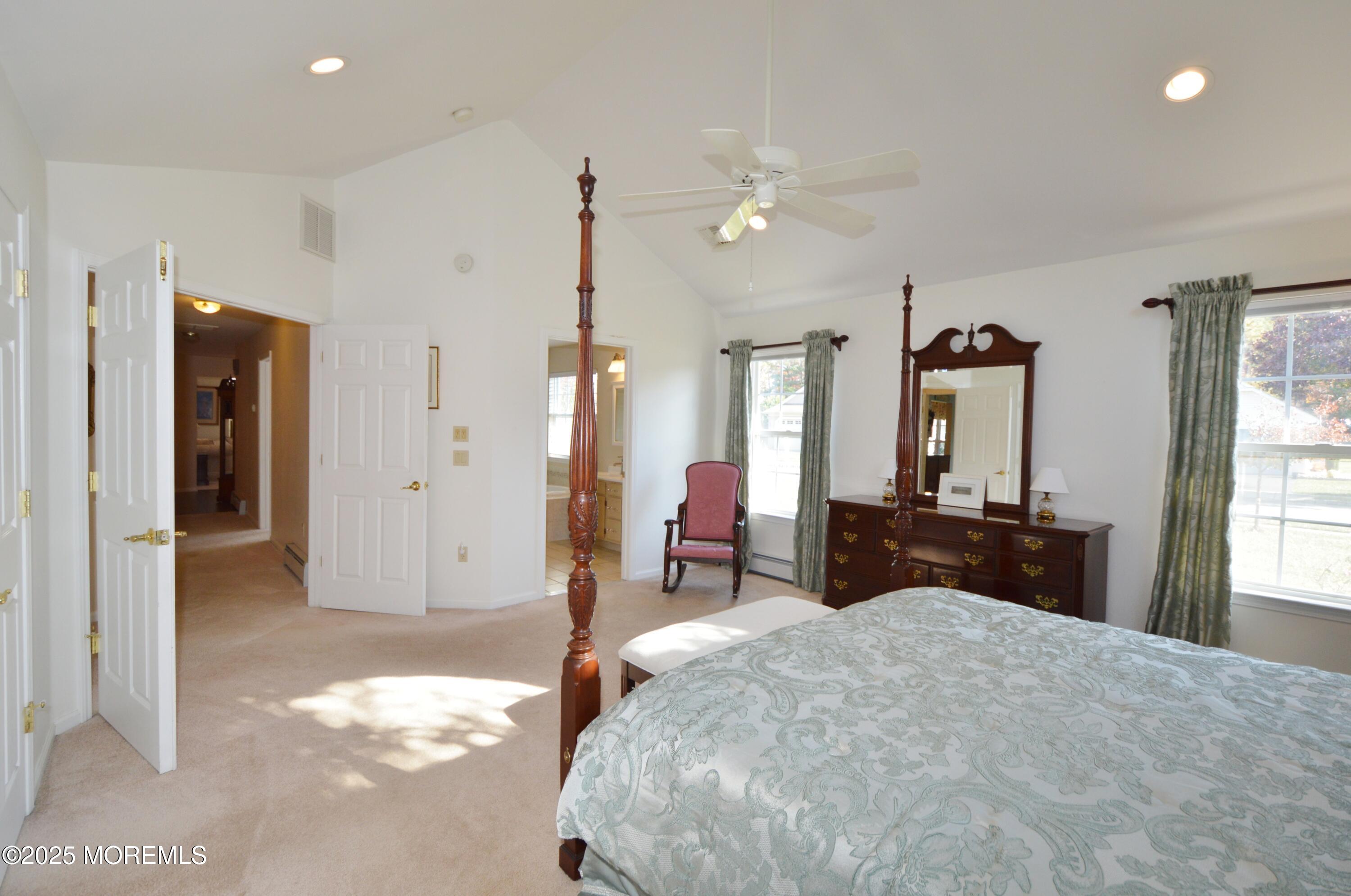 2382 Braddock Road Toms River, NJ 08755 - Photo 31 of 56 a bedroom with a bed and a chandelier