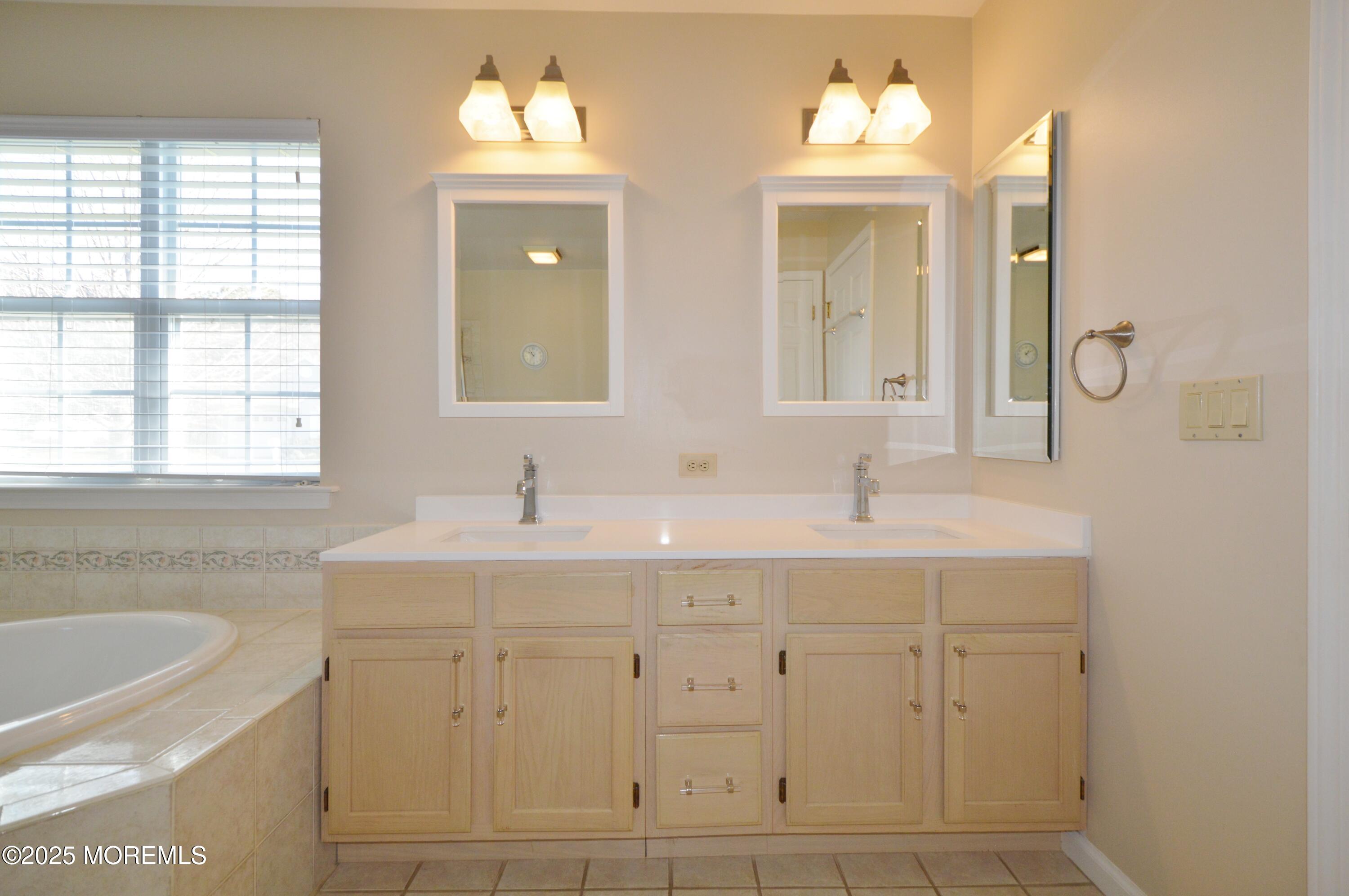 2382 Braddock Road Toms River, NJ 08755 - Photo 33 of 56 a bathroom with double sink and a mirror