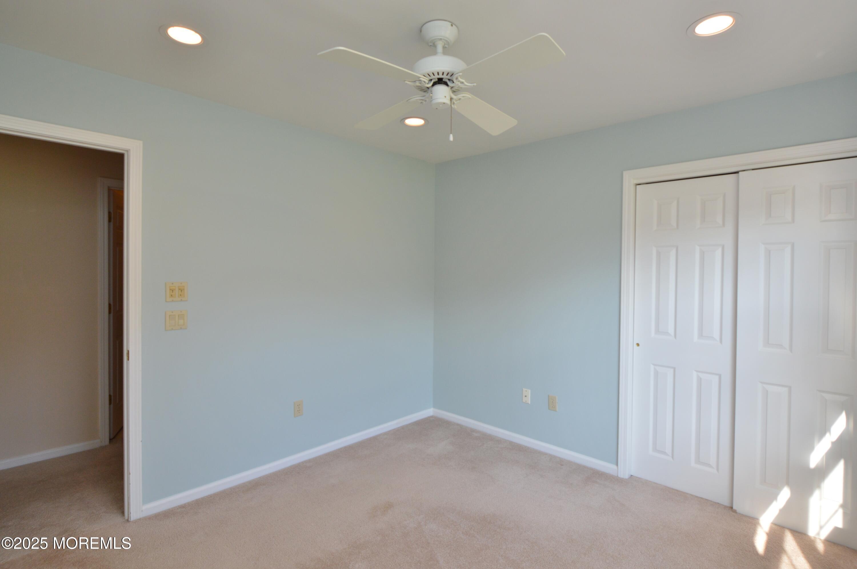 2382 Braddock Road Toms River, NJ 08755 - Photo 38 of 56 an empty room with a ceiling fan and a window