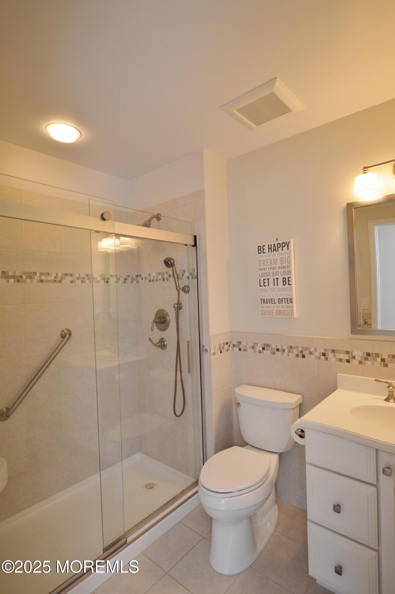 2382 Braddock Road Toms River, NJ 08755 - Photo 40 of 56 a bathroom with a shower toilet and sink