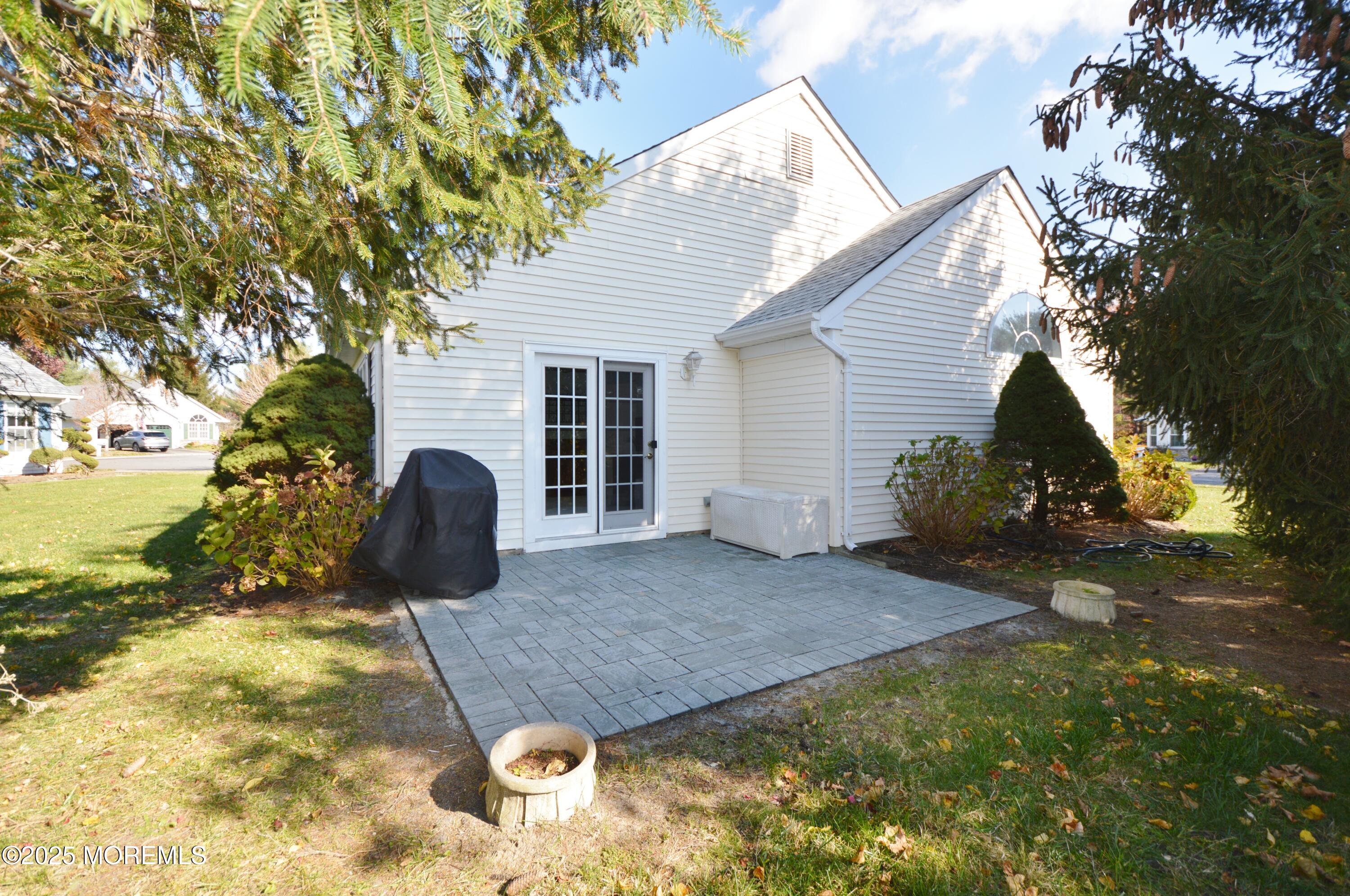2382 Braddock Road Toms River, NJ 08755 - Photo 44 of 56 a view of a backyard with plants and a patio