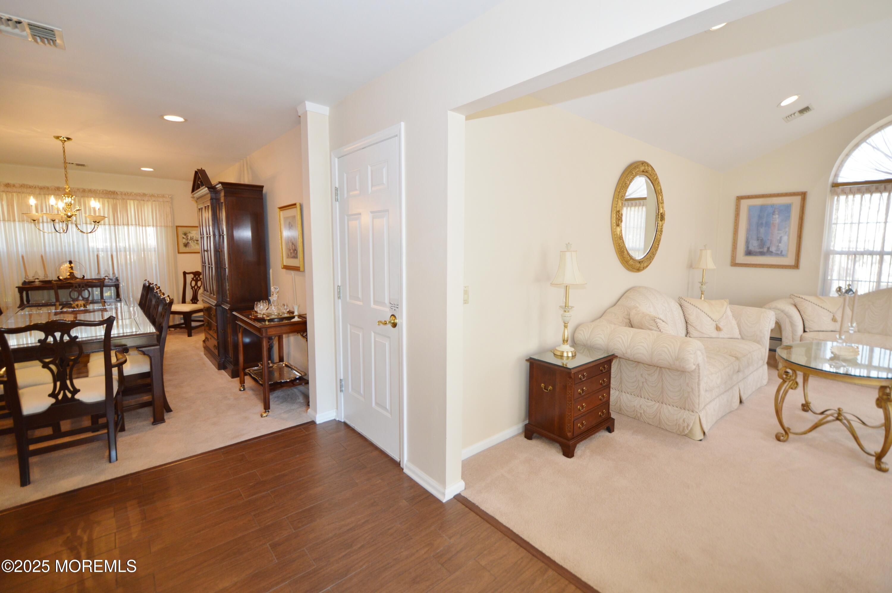 2382 Braddock Road Toms River, NJ 08755 - Photo 5 of 56 a living room with couches and kitchen view with wooden floor