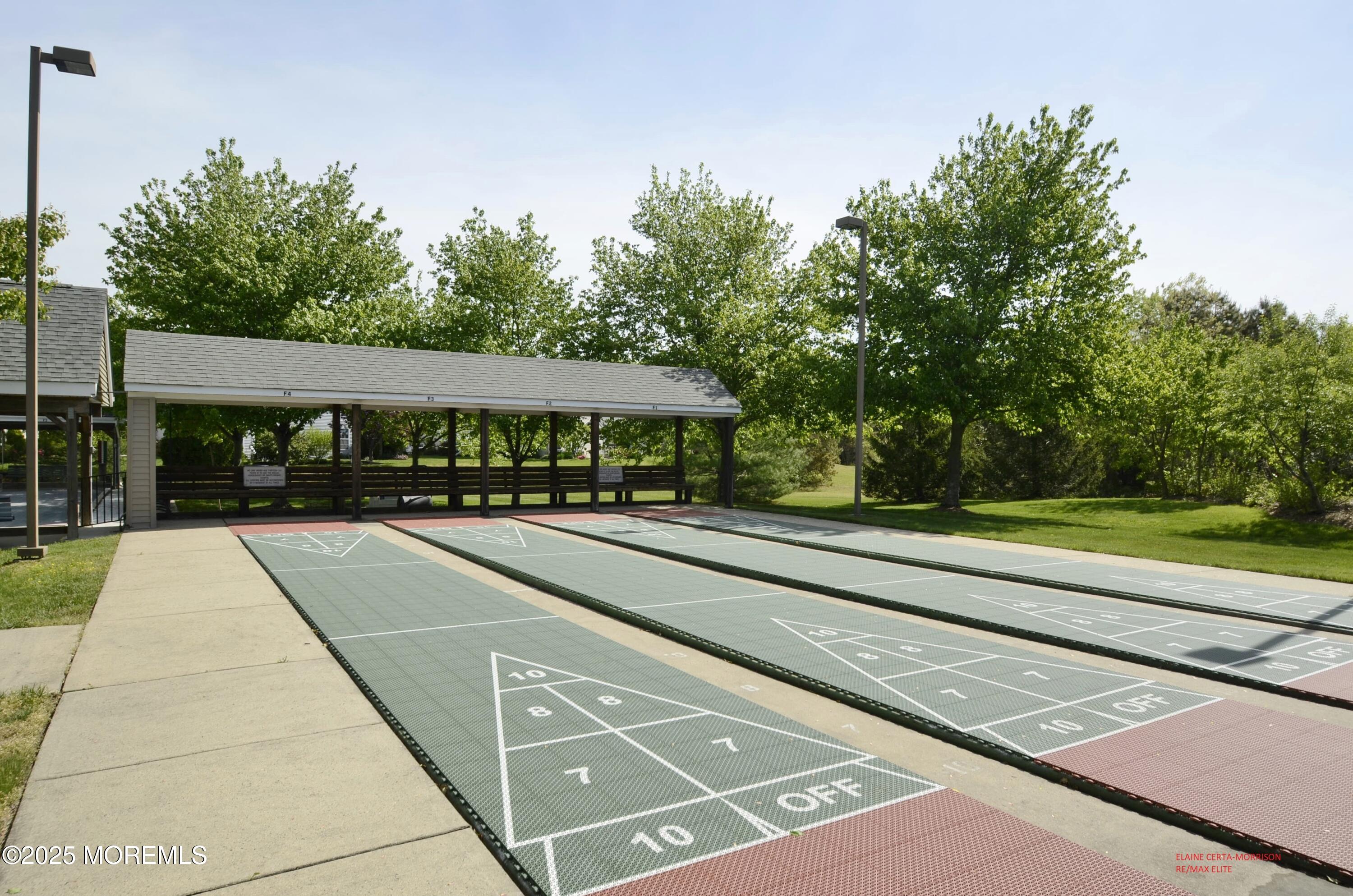 2382 Braddock Road Toms River, NJ 08755 - Photo 56 of 56 a view of a tennis court with a fountain in the background