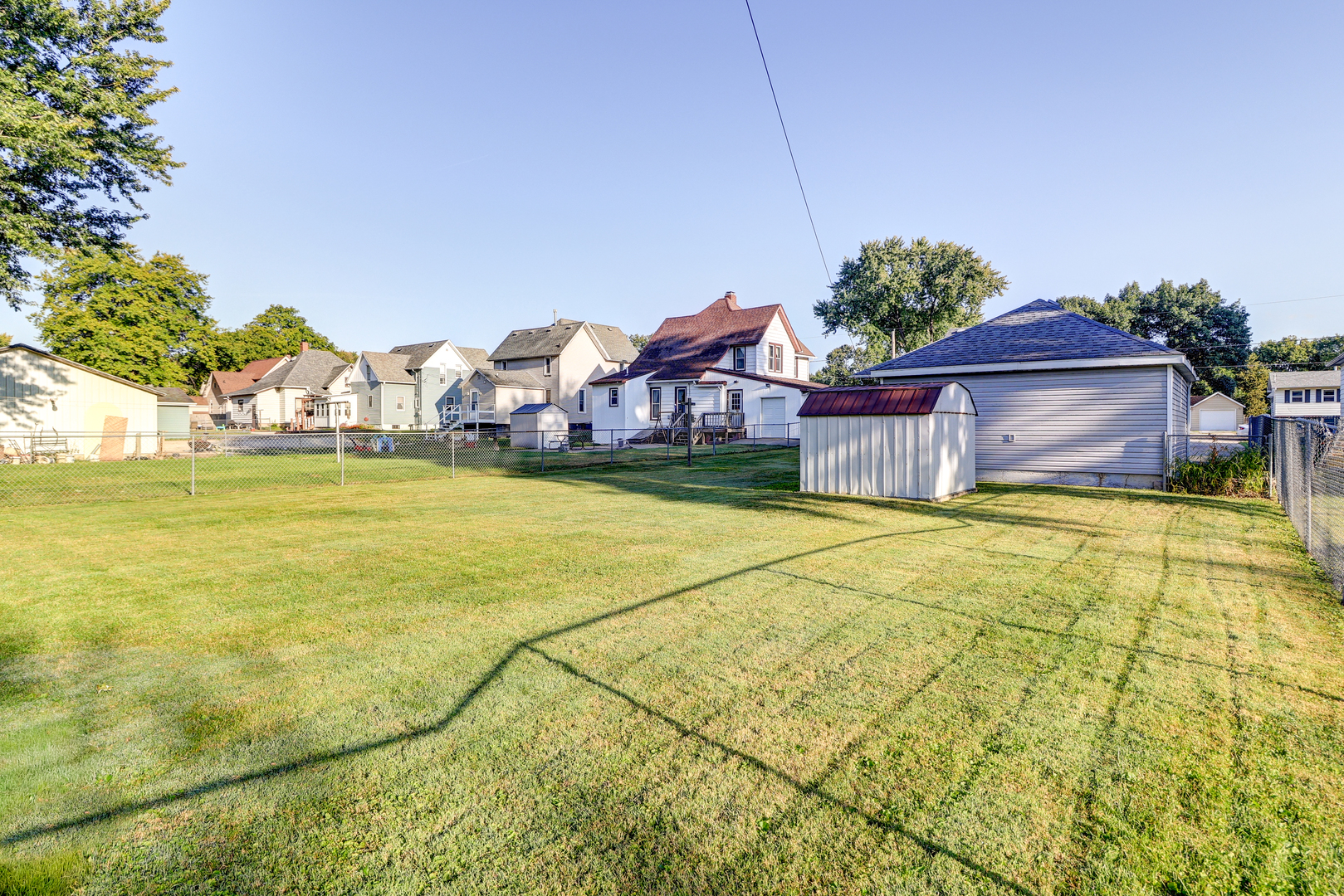 602 East 3rd Street Rock Falls, IL 61071 - Photo 22 of 22 a view of a swimming pool with a lawn chairs under an umbrella